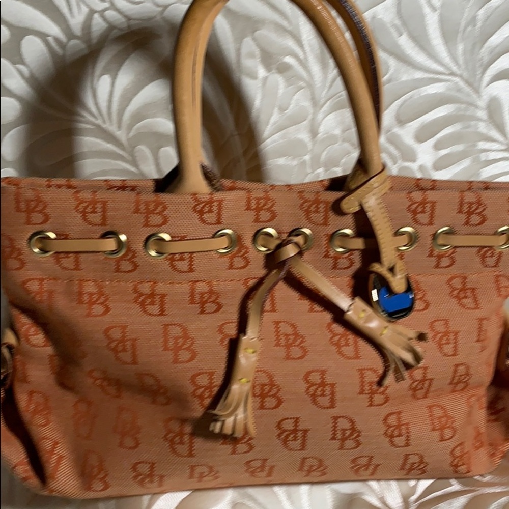 Dooney & Bourke orange monogram tassel tote